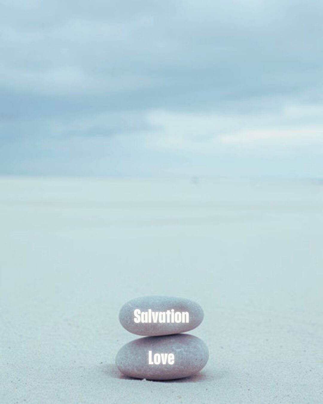 Stacked pebbles labeled 'Salvation' and 'Love'